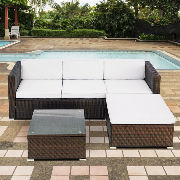 Petekar 3 piece rattan sectional seating group with online cushions